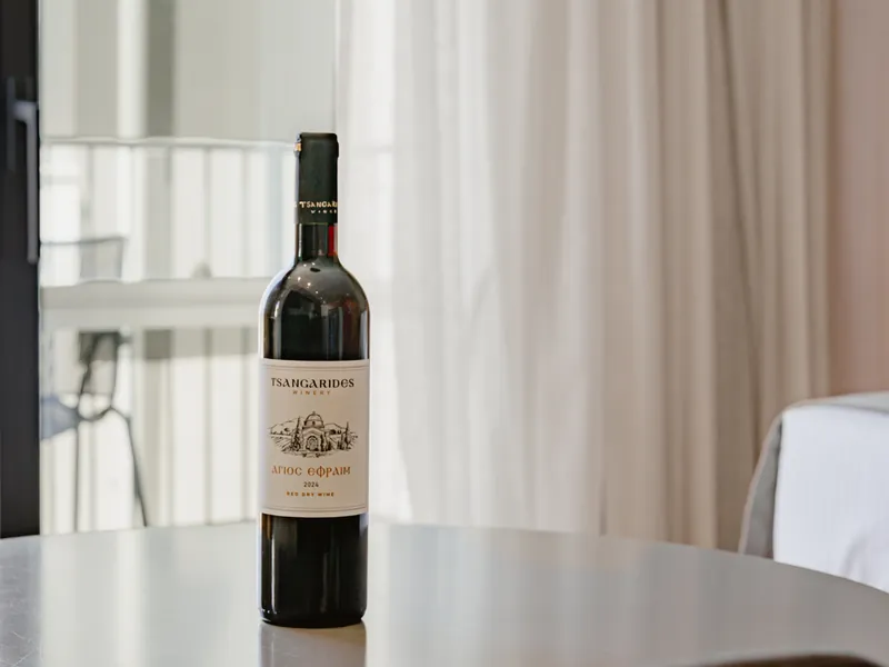 Bottle of Cypriot house wine on the table of an Anemi guest room